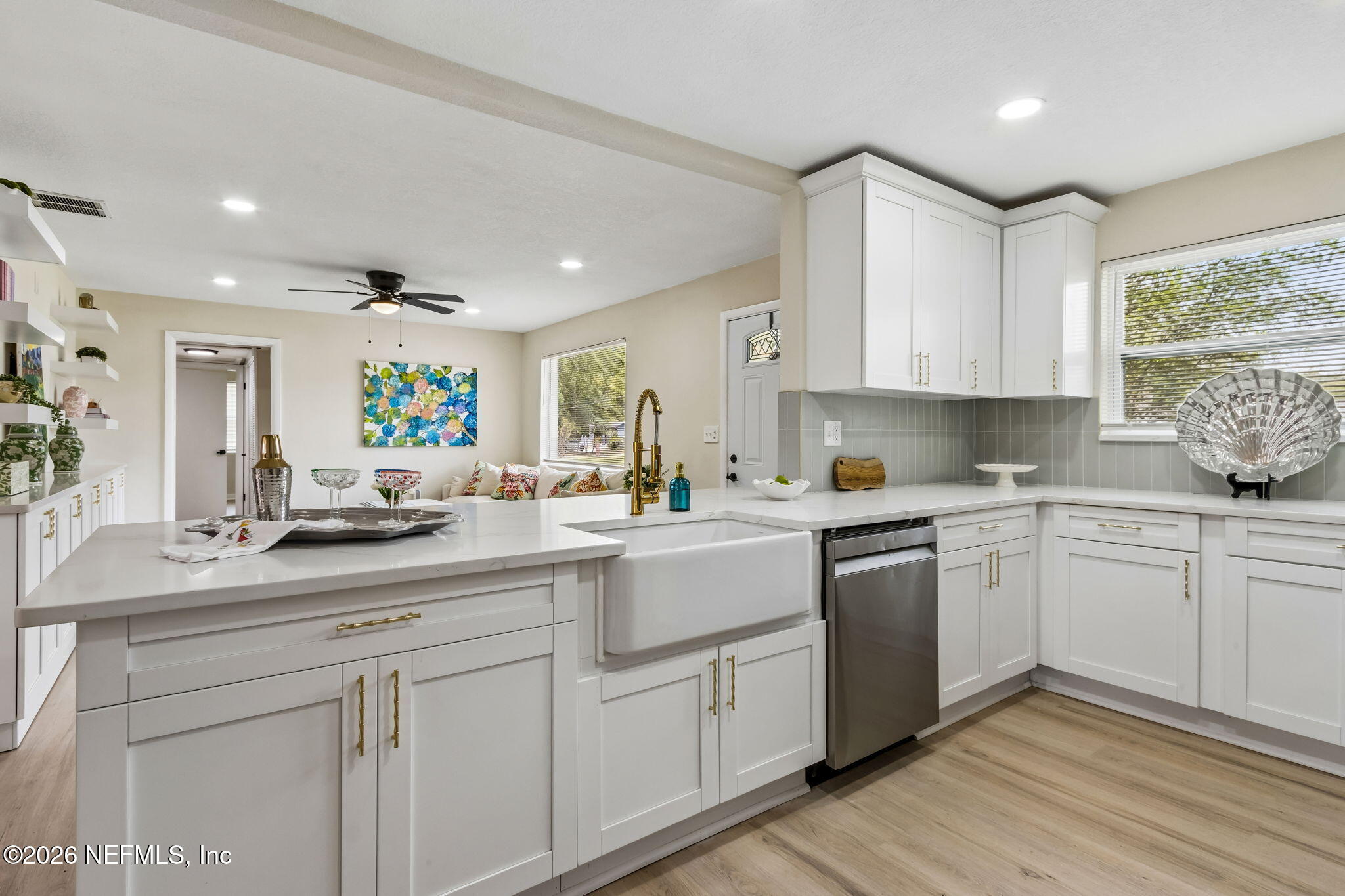 3668 Marianna Road Jacksonville, FL 32217 - Photo 9 of 28 a kitchen with white cabinets appliances and a window