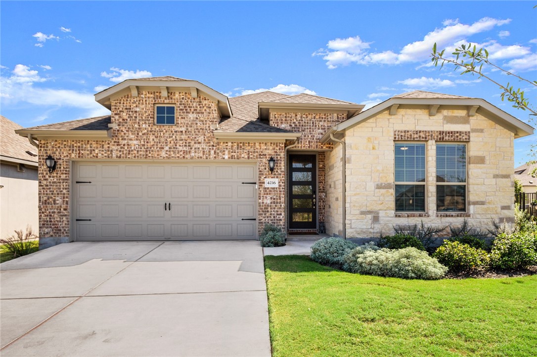 4216 Cella Place Leander, TX 78641 - Photo 1 of 1 a front view of a house with a yard