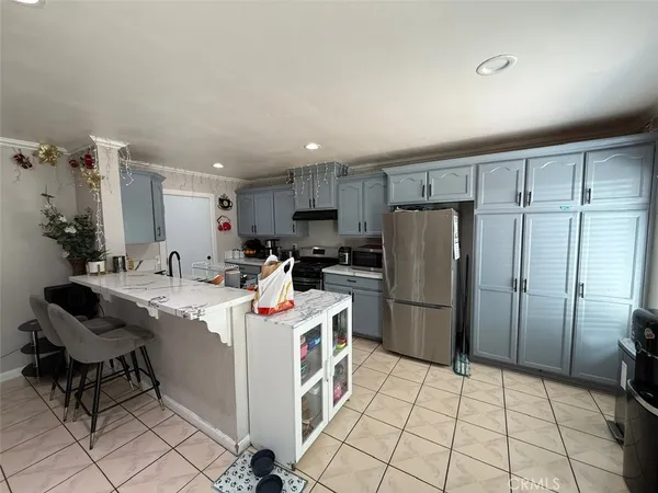 a kitchen with a sink cabinets and stainless steel appliances