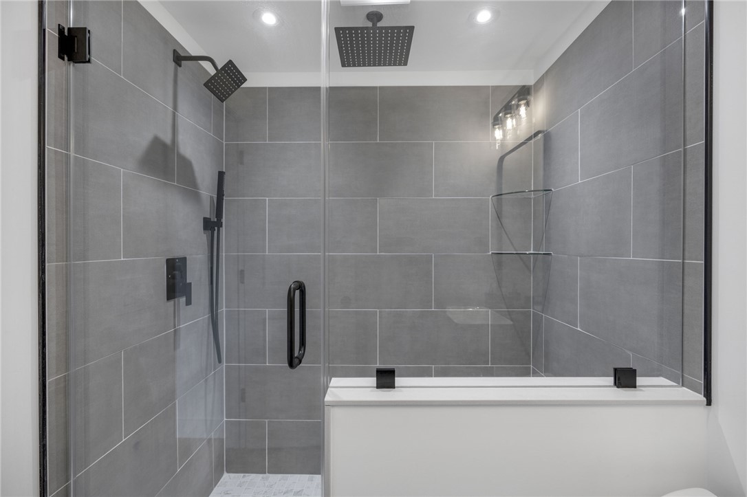 1230 Melton Road, Unit 30 West Union, SC 29696 - Photo 19 of 42 Indulge in a spa-like retreat with this contemporary walk-in shower, featuring dual showerheads and sleek tile work.