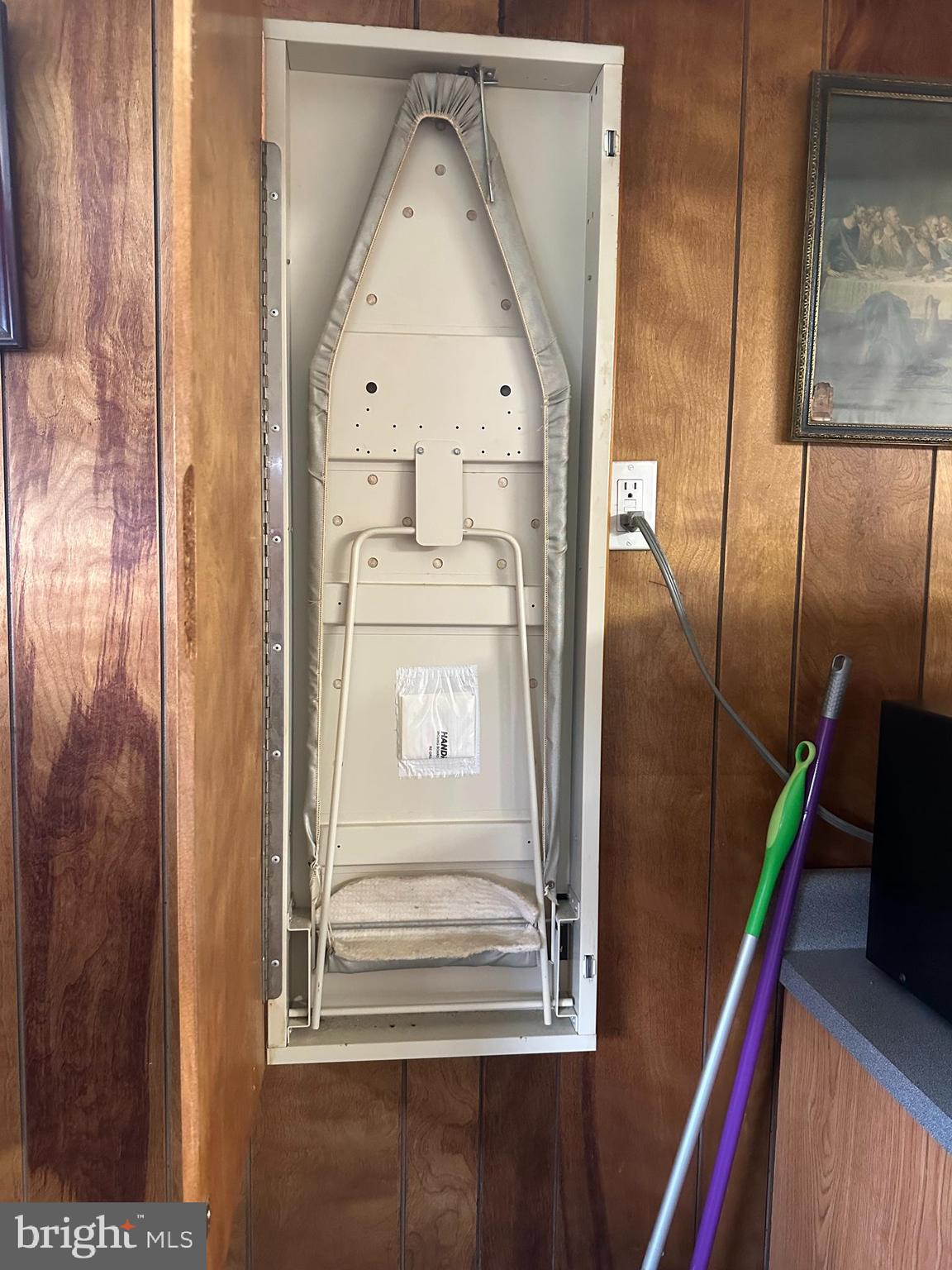 48 East 22nd Street Chester, PA 19013 - Photo 14 of 16 Hide away Ironing Board in kitchen