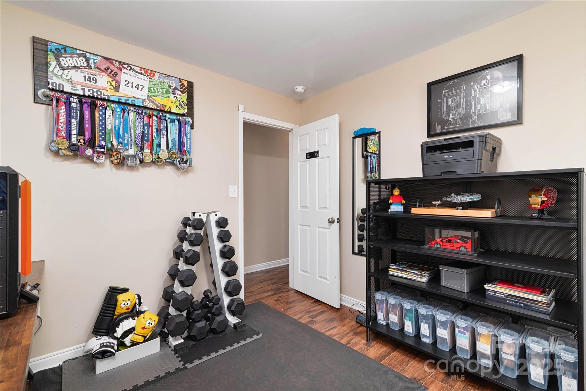 1216 Stevens Road Monroe, NC 28110 - Photo 14 of 40 a bedroom with furniture a flat screen tv and a window