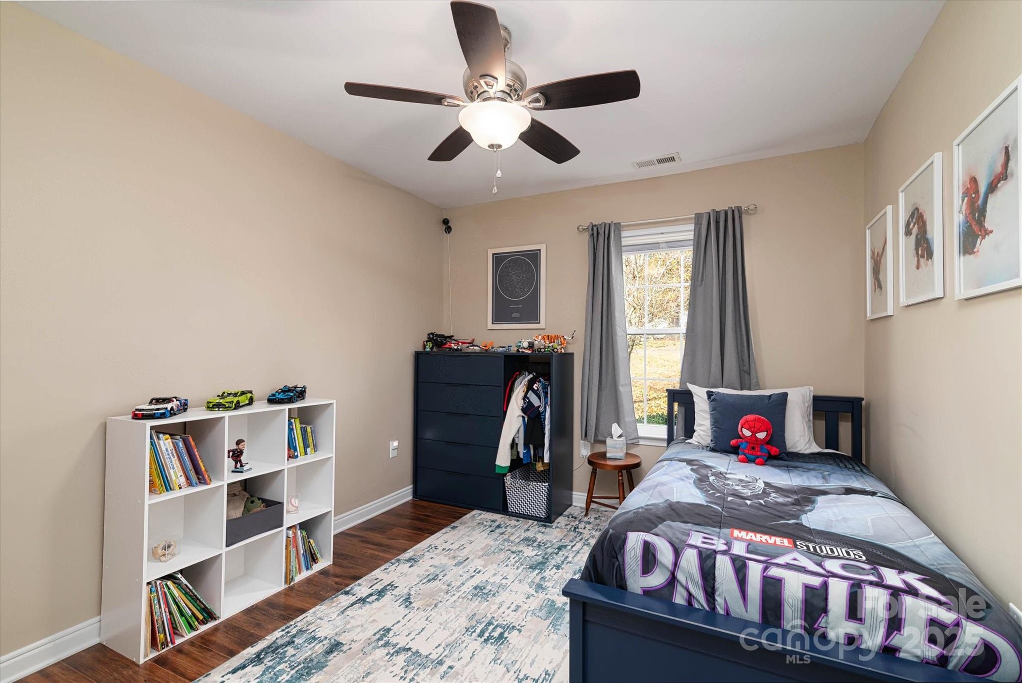 1216 Stevens Road Monroe, NC 28110 - Photo 17 of 40 a bedroom with a bed and a bookshelf