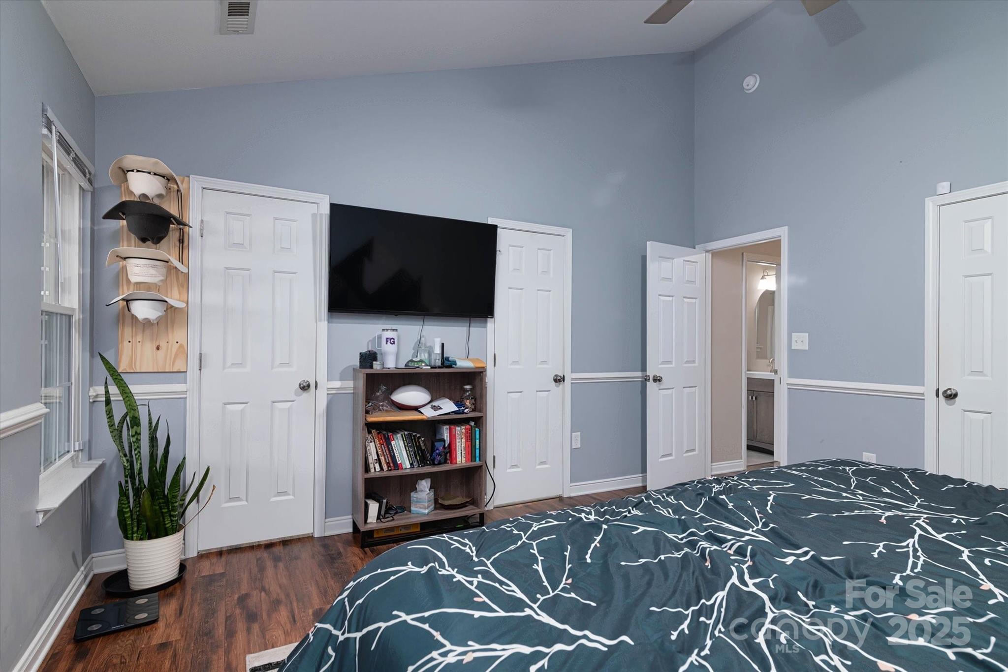 1216 Stevens Road Monroe, NC 28110 - Photo 20 of 40 a bedroom with a bed and a flat screen tv
