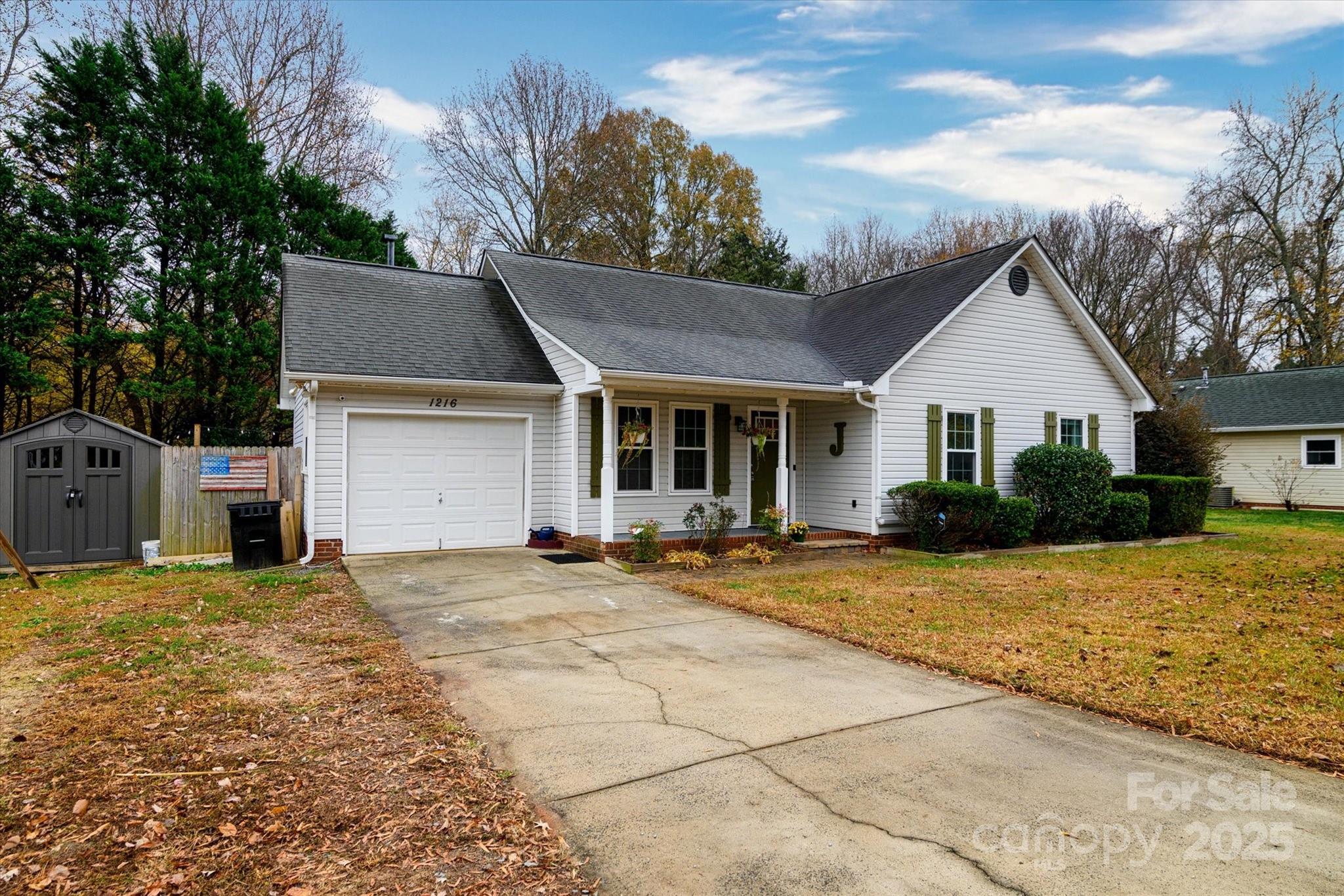 1216 Stevens Road Monroe, NC 28110 - Photo 2 of 40 a view of a house with a yard and large tree