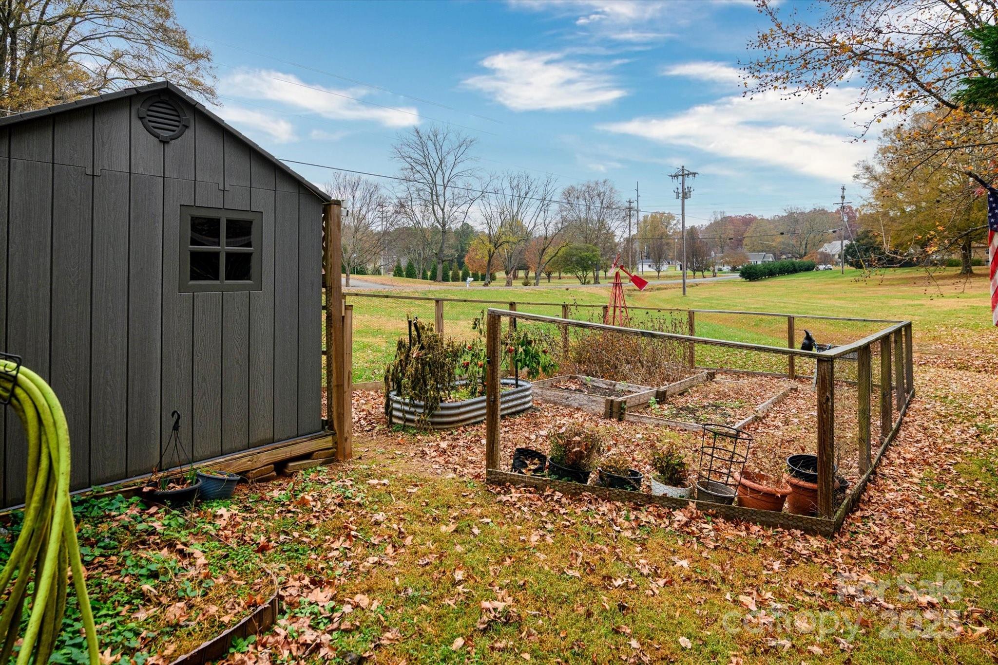 1216 Stevens Road Monroe, NC 28110 - Photo 30 of 40 a view of a chair and table on the wooden floor