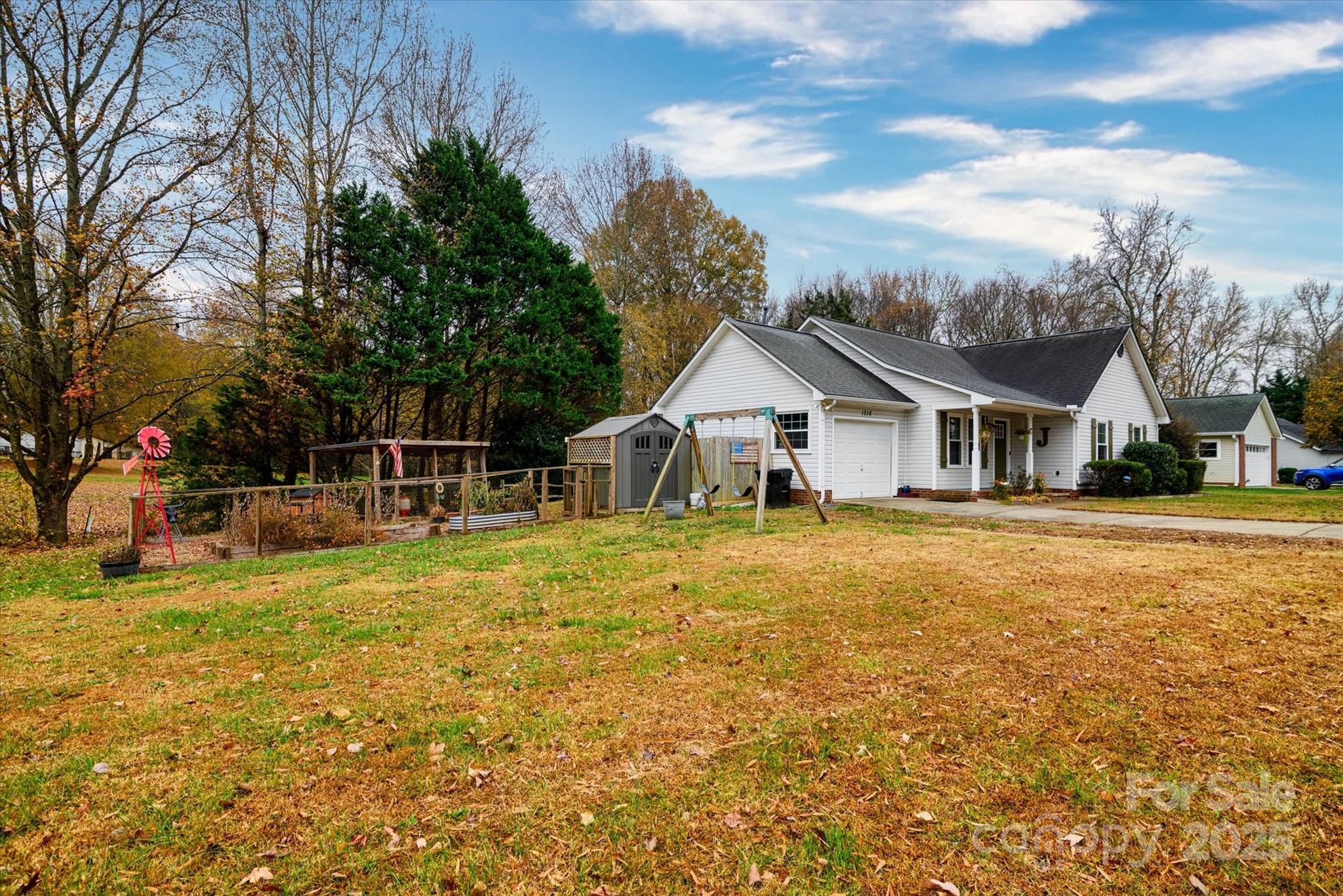 1216 Stevens Road Monroe, NC 28110 - Photo 35 of 40 a front view of house with yard outdoor seating and barbeque oven