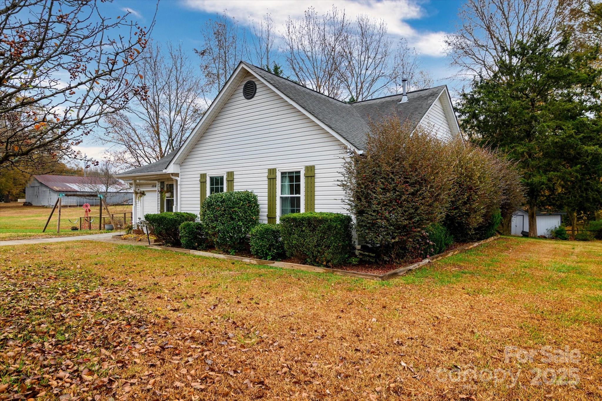1216 Stevens Road Monroe, NC 28110 - Photo 4 of 40 a view of a house with a yard