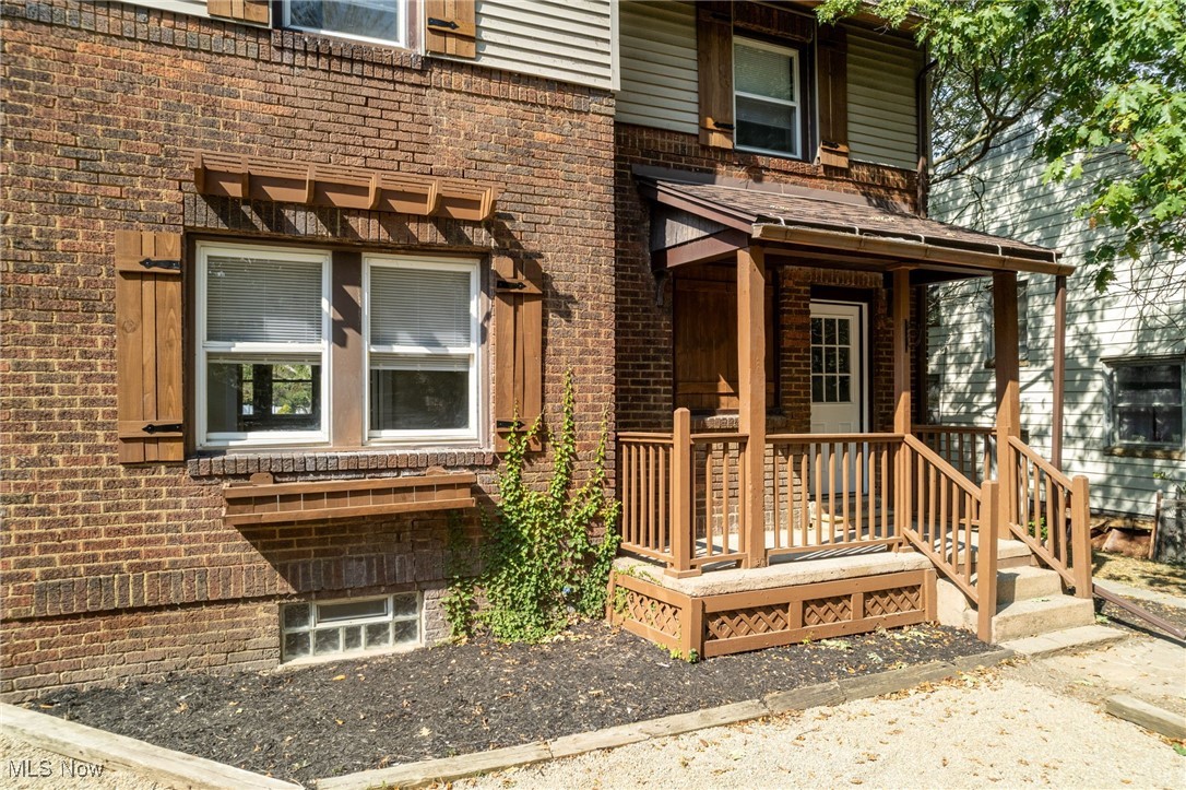 555 Brittain Road Akron, OH 44305 - Photo 3 of 26 Property entrance featuring brick siding and a porch