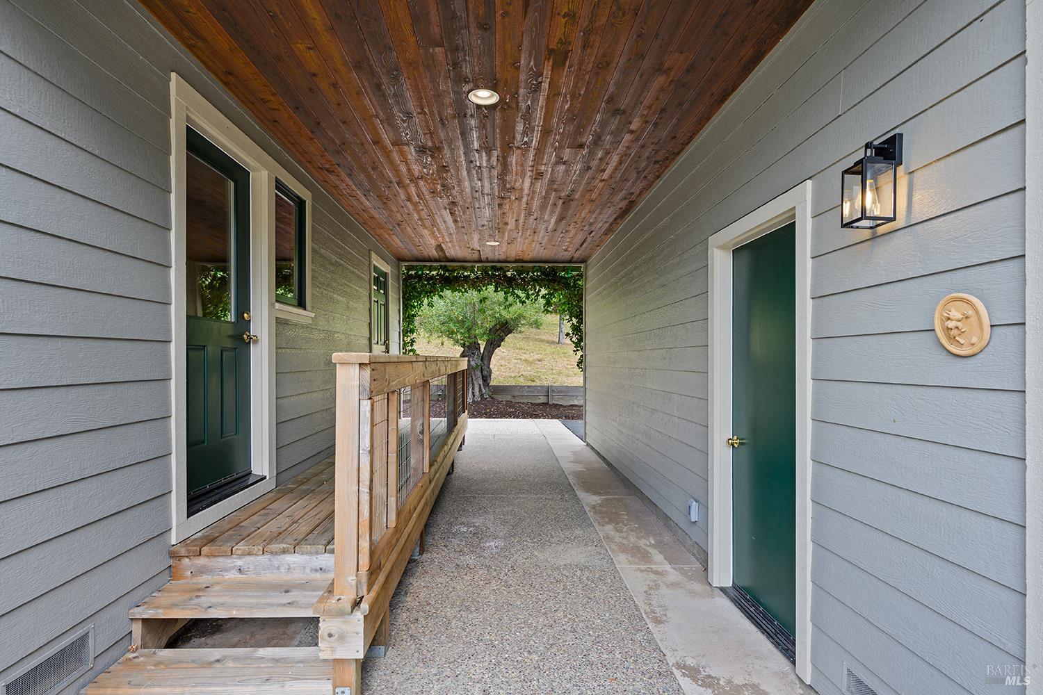 2585 Marra Road Occidental, CA 95465 - Photo 41 of 58 Breezeway with access to laundry room and wine storeage on the house side, and garage and detached guest room on the other.