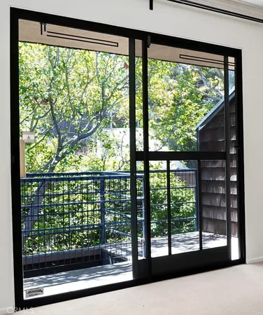 a view of a room that has a large window