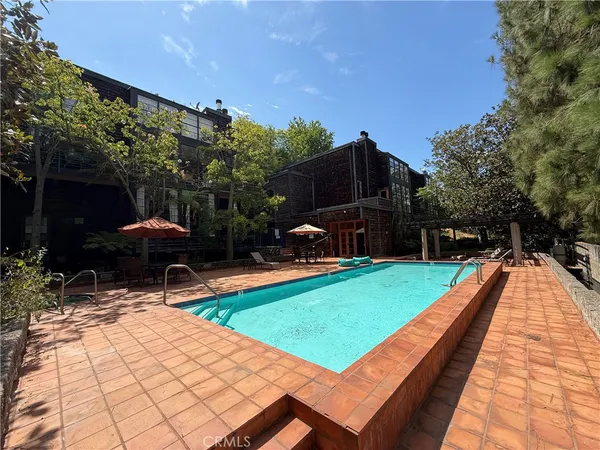 a view of a backyard with sitting area