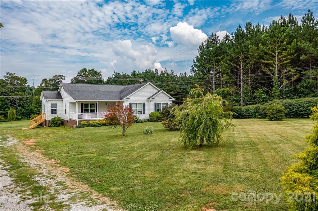 4478 Hickory Nut Ridge Road Hudson, NC 28638 - Photo 4 of 29 a front view of house with yard and green space