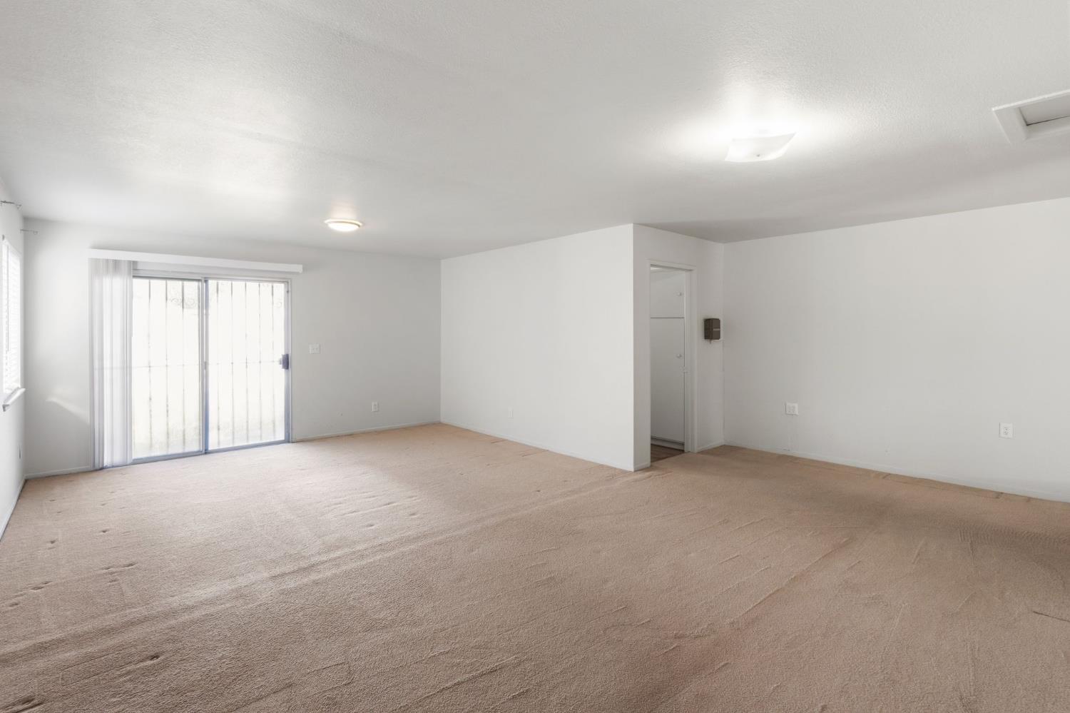 2315 Tyrolean Way Sacramento, CA 95821 - Photo 12 of 27 an empty room with a empty space and windows