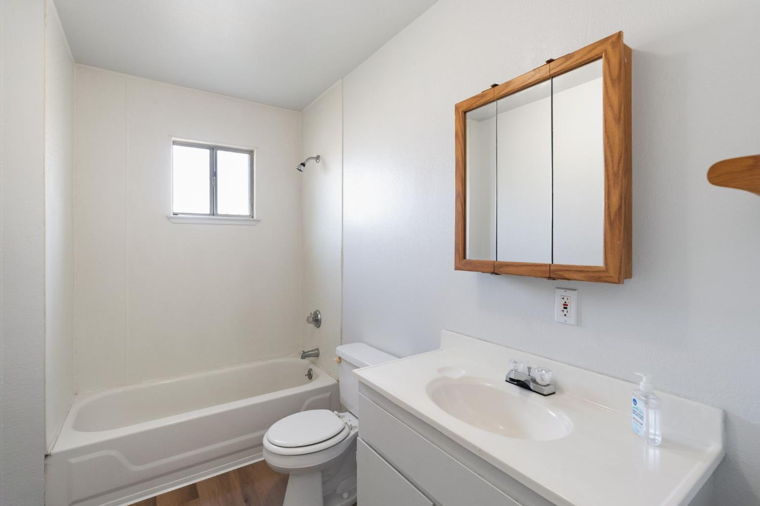 2315 Tyrolean Way Sacramento, CA 95821 - Photo 15 of 27 a bathroom with a sink a toilet and shower