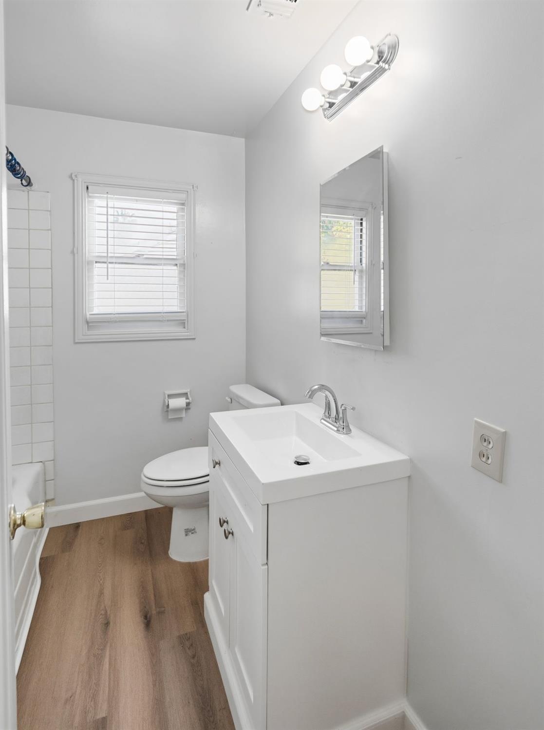 2315 Tyrolean Way Sacramento, CA 95821 - Photo 17 of 27 a bathroom with a sink a toilet and mirror