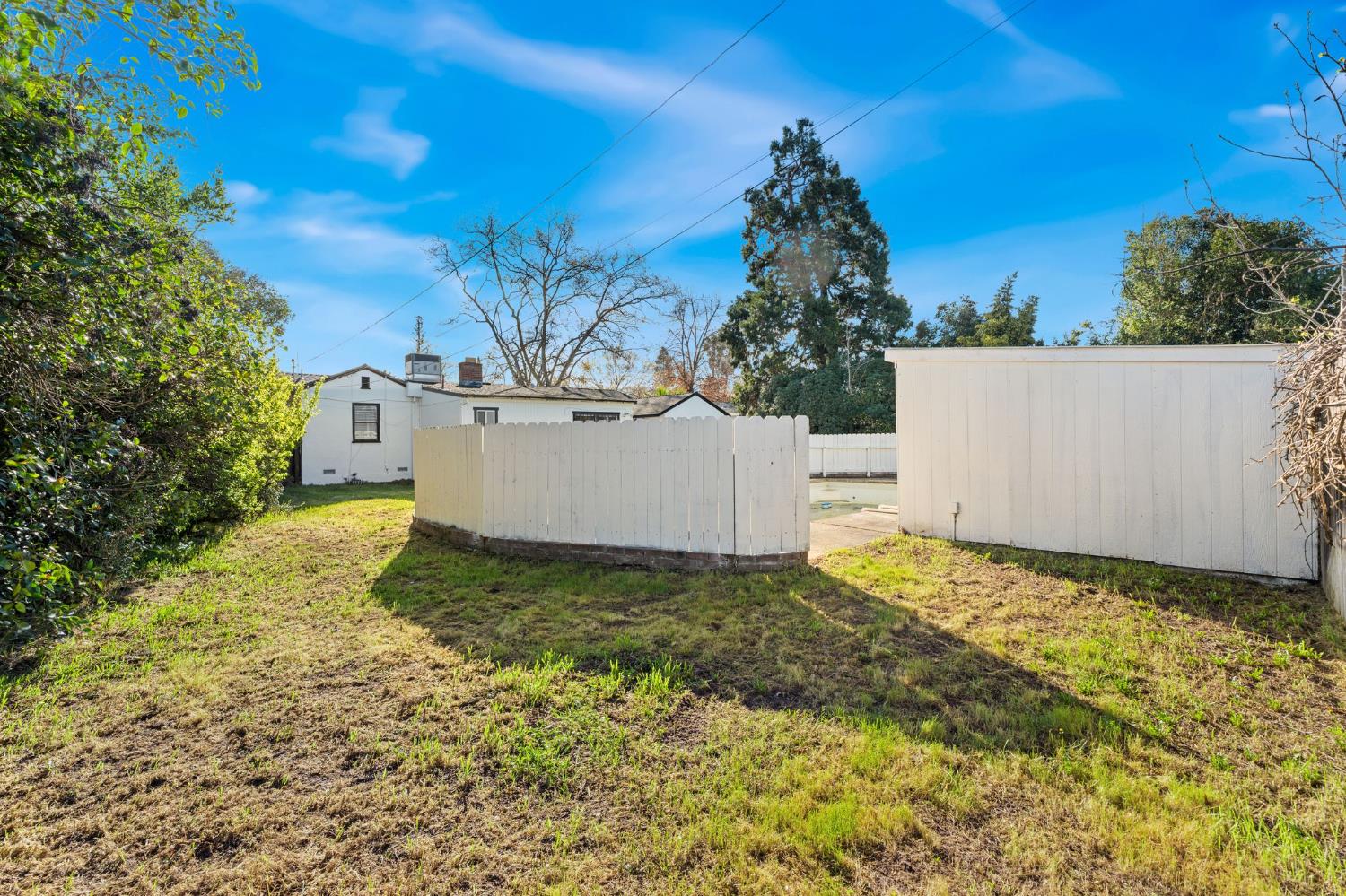 2315 Tyrolean Way Sacramento, CA 95821 - Photo 22 of 27 a view of a white house with a yard