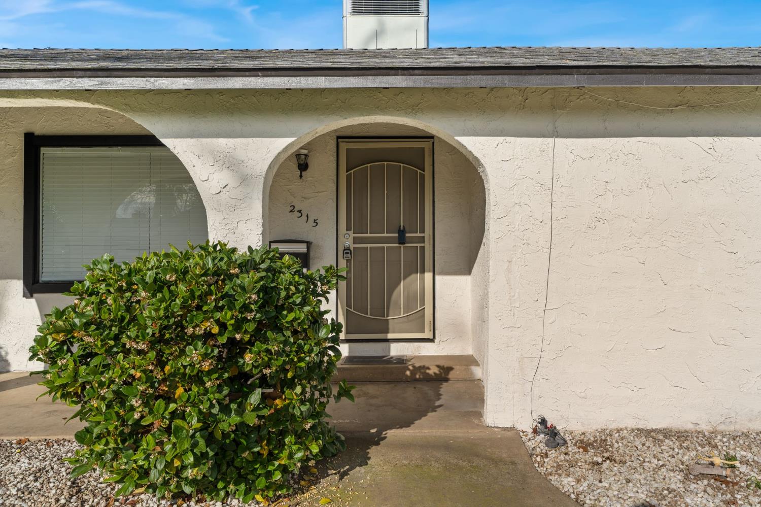2315 Tyrolean Way Sacramento, CA 95821 - Photo 24 of 27 a front view of a house with a garden