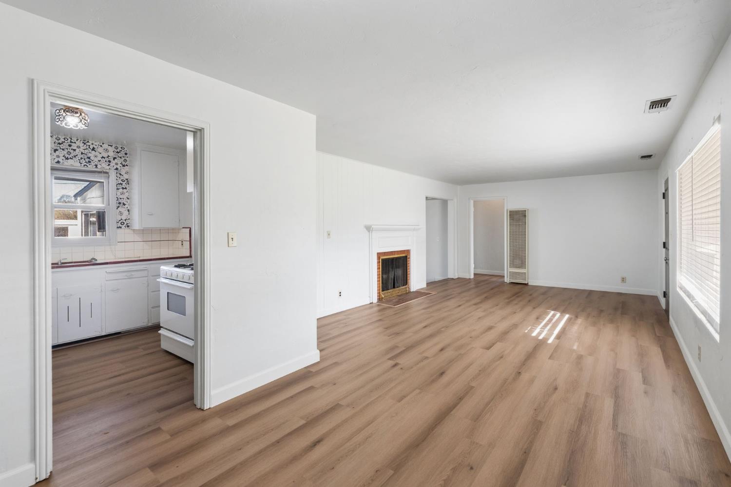 2315 Tyrolean Way Sacramento, CA 95821 - Photo 6 of 27 a view of a kitchen with wooden floor and a sink