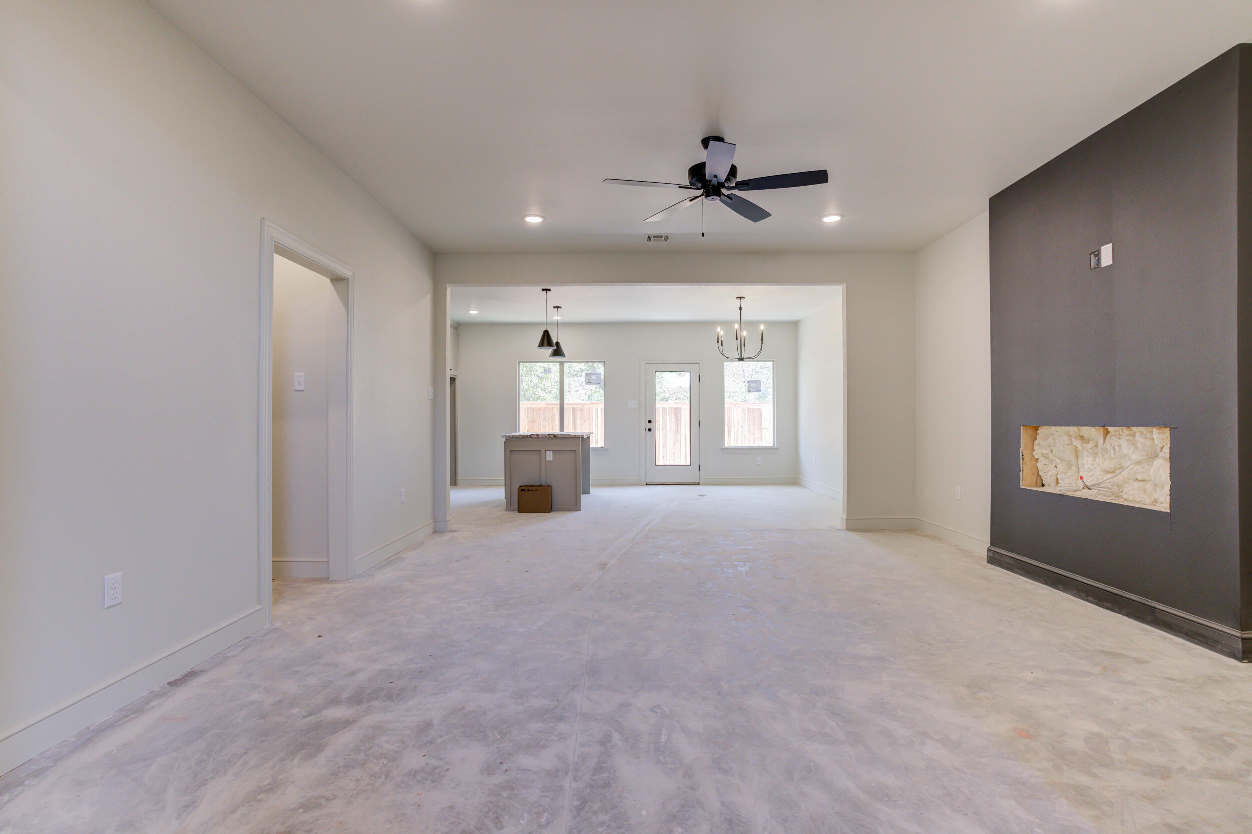 3421 24th Street Lubbock, TX 79410 - Photo 12 of 45 a view of an empty room with a window and fireplace