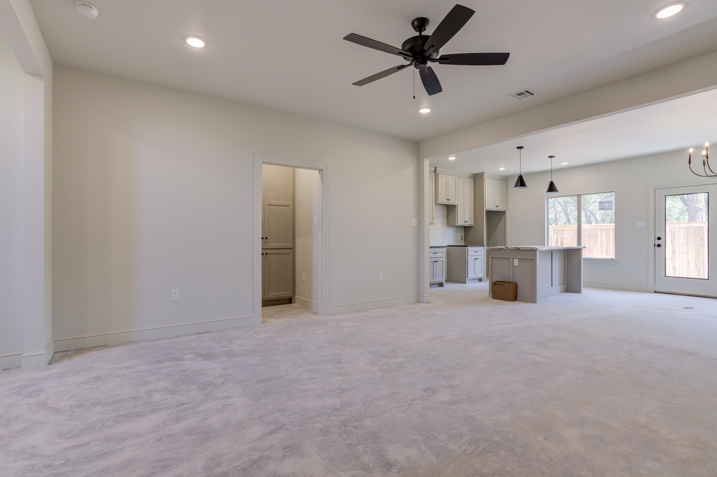 3421 24th Street Lubbock, TX 79410 - Photo 14 of 45 a view of empty room with wooden floor and window