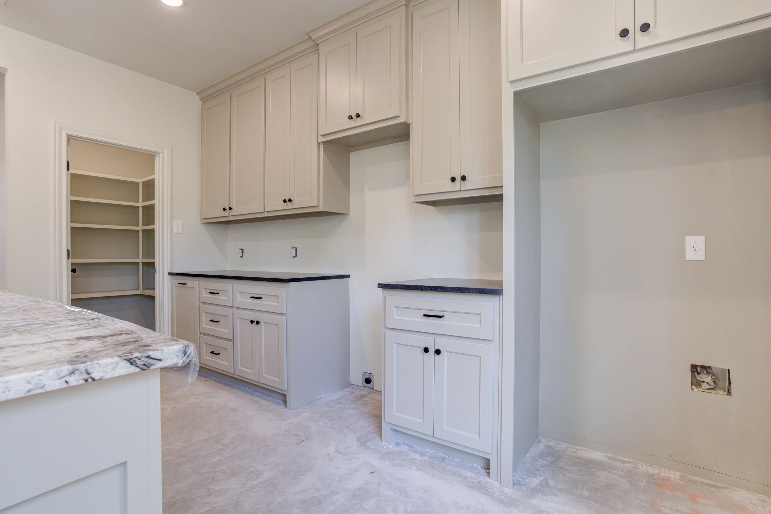 3421 24th Street Lubbock, TX 79410 - Photo 18 of 45 a kitchen with cabinets oven and a dishwasher