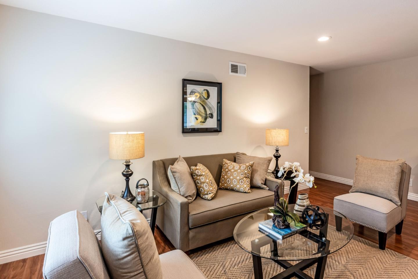 2323 Saidel Drive, Unit 4 San Jose, CA 95124 - Photo 11 of 23 a living room with furniture and a lamp