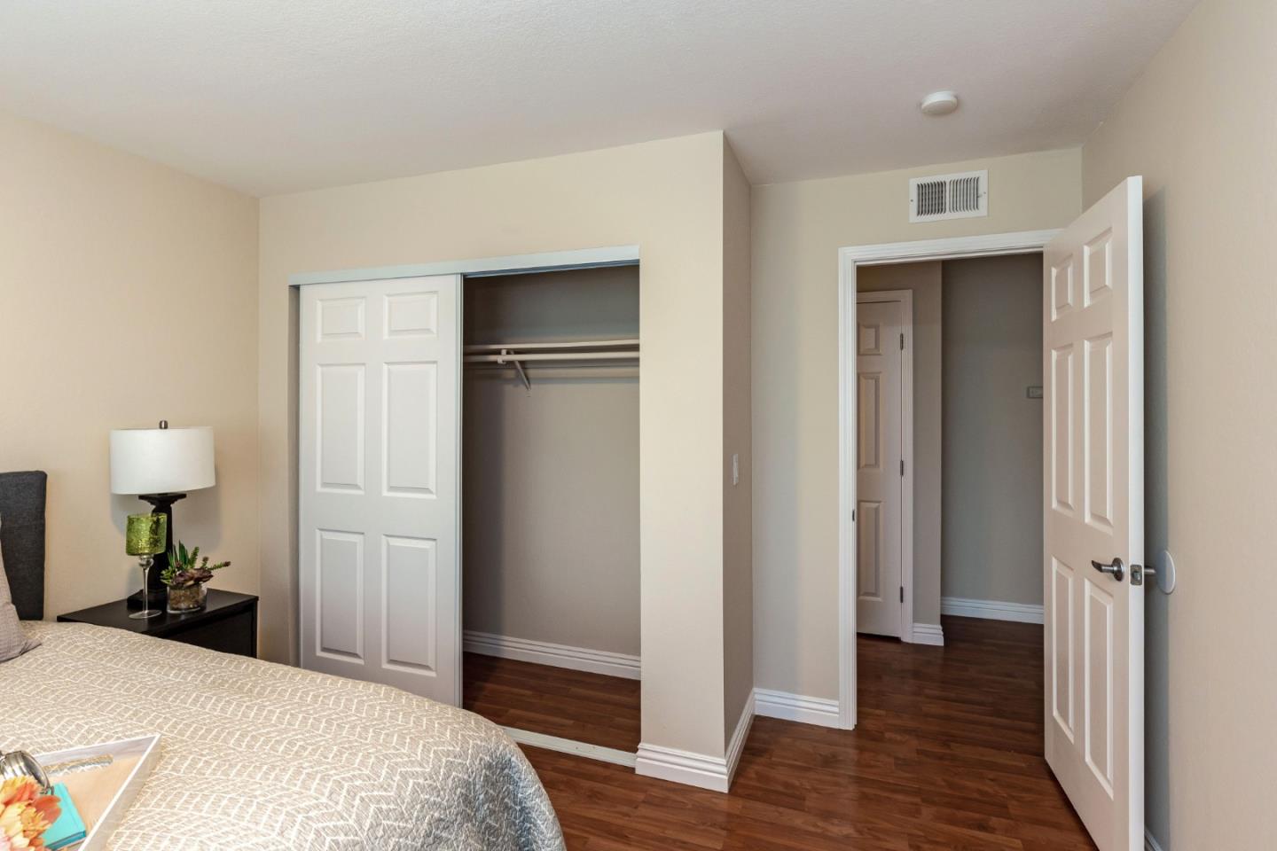 2323 Saidel Drive, Unit 4 San Jose, CA 95124 - Photo 19 of 23 a bedroom with a bed and a walk in closet