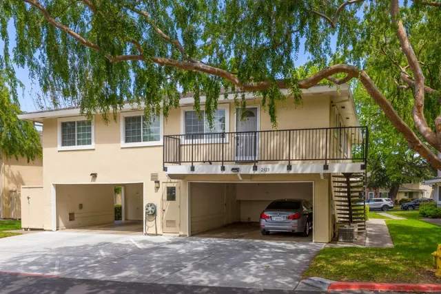 a view of a car parked in front of a house