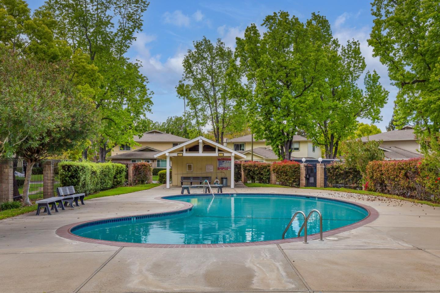 2323 Saidel Drive, Unit 4 San Jose, CA 95124 - Photo 8 of 23 a view of a swimming pool with lawn chairs and plants