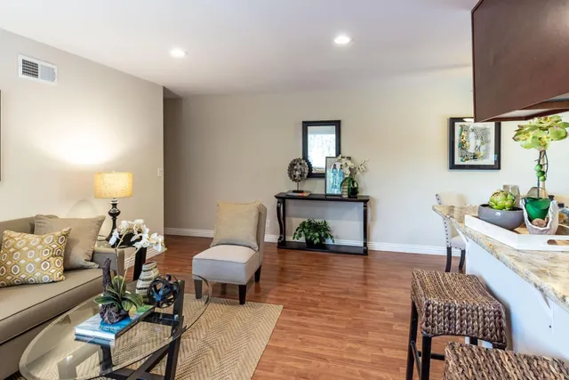 a living room with furniture and a lamp