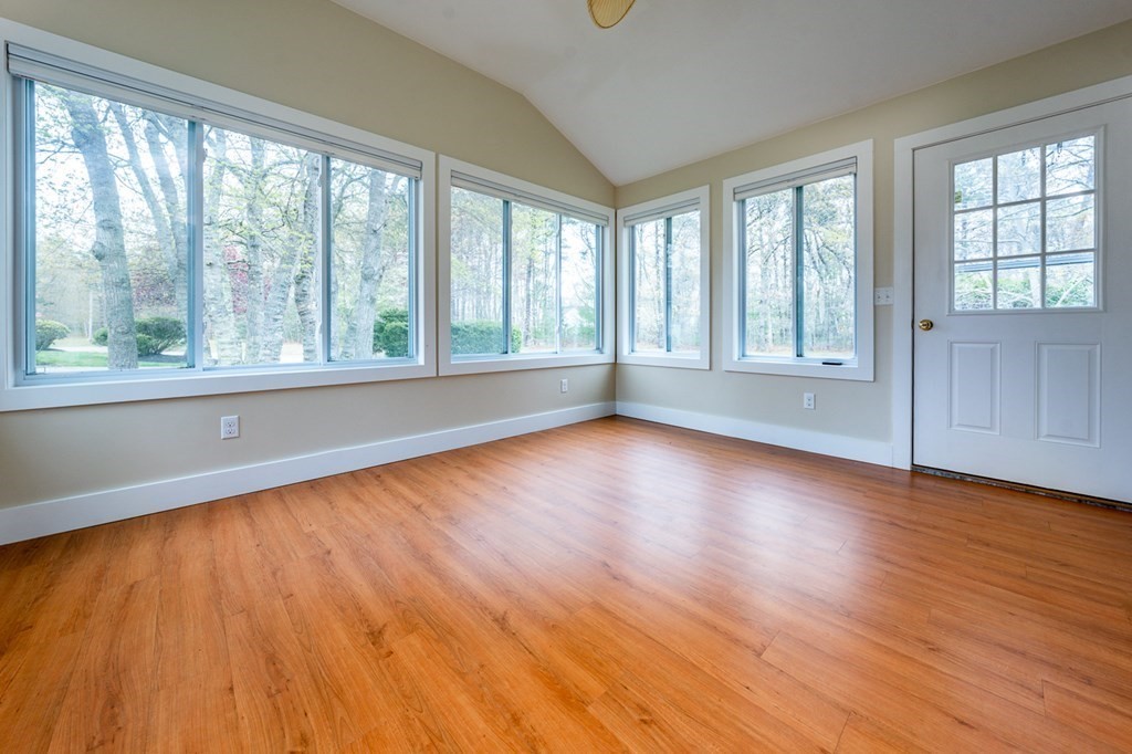 9 Executive Drive, Unit 286 Mashpee, MA 02649 - Photo 8 of 15 a view of empty room with wooden floor and fan