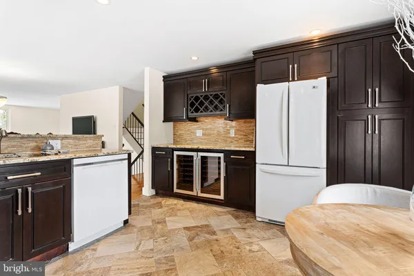 a kitchen with stainless steel appliances a refrigerator and a stove