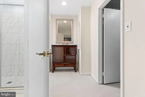 a view of front door with cabinets