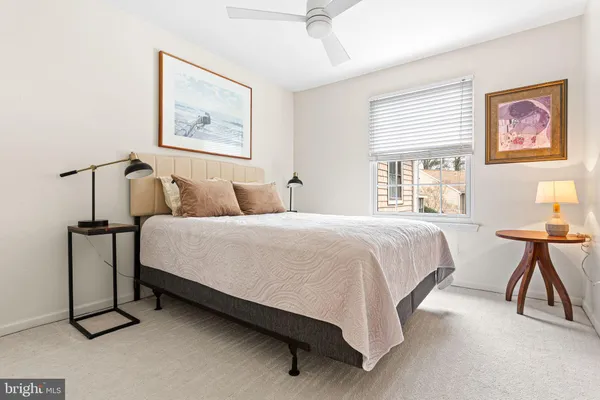 a bedroom with a bed and a table