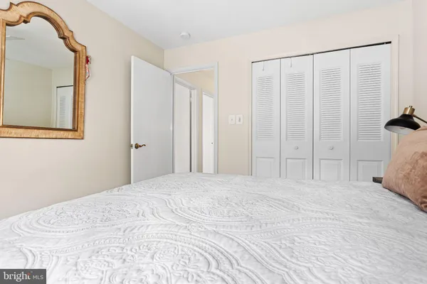 a large white bed in a white room