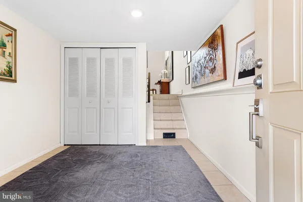 a view of an entryway with wooden floor