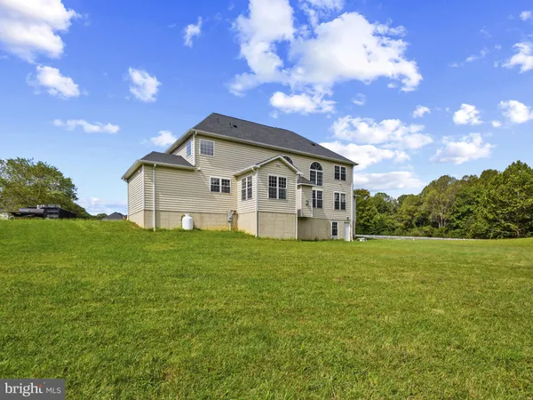 a view of a house with a big yard
