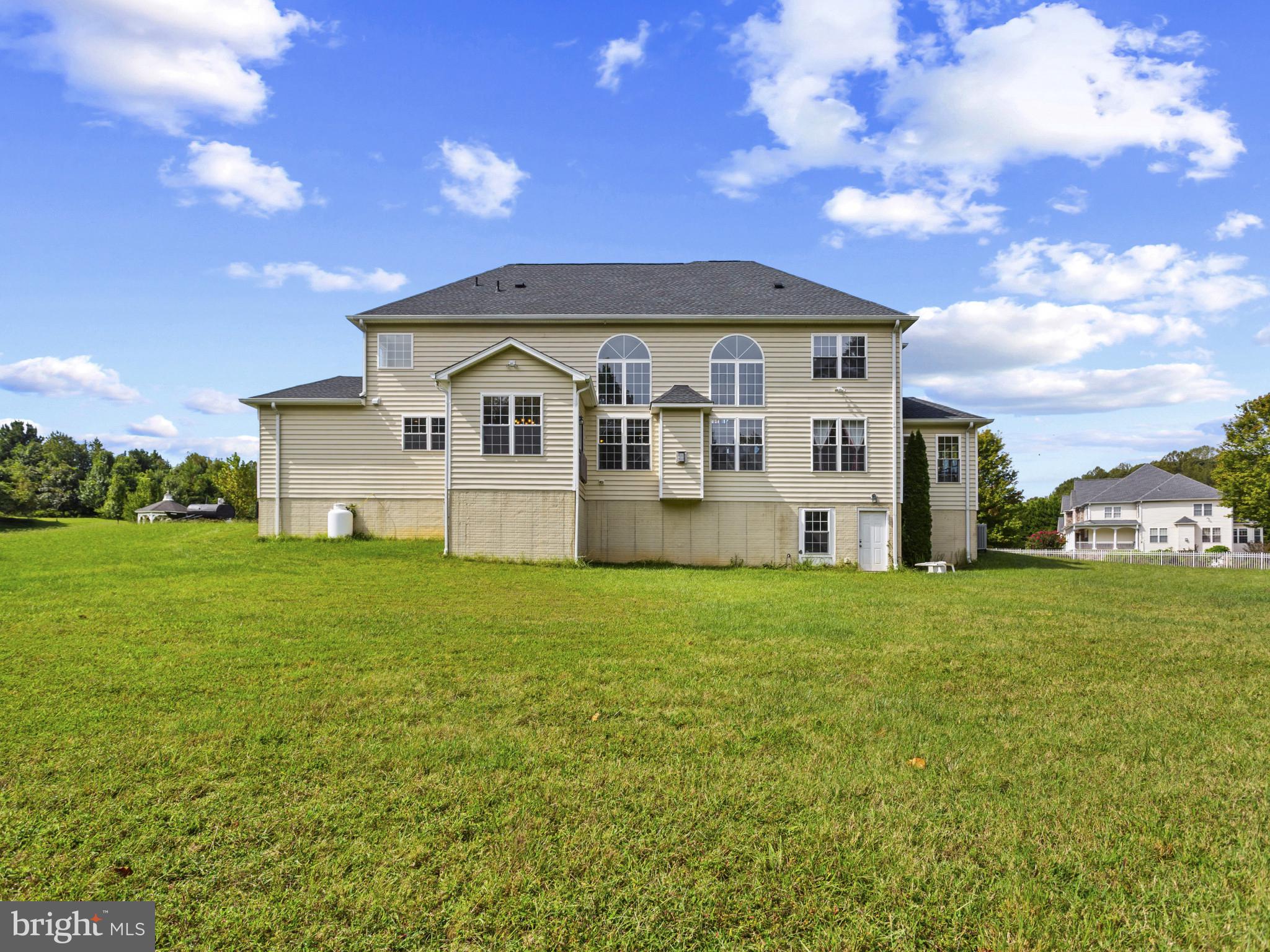 2045 Mount Pleasant Way Prince Frederick, MD 20678 - Photo 29 of 30 a front view of a house with a garden