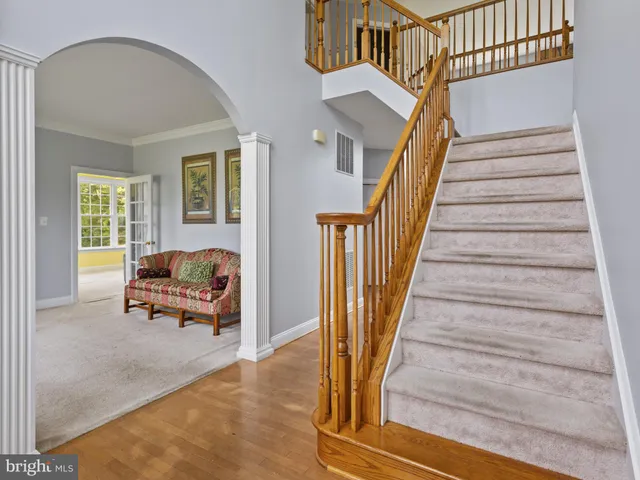a view of entryway livingroom and hall