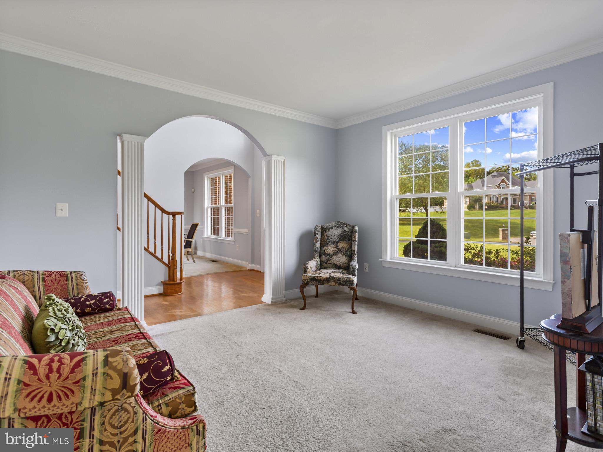 2045 Mount Pleasant Way Prince Frederick, MD 20678 - Photo 10 of 30 a living room with furniture and a floor to ceiling window