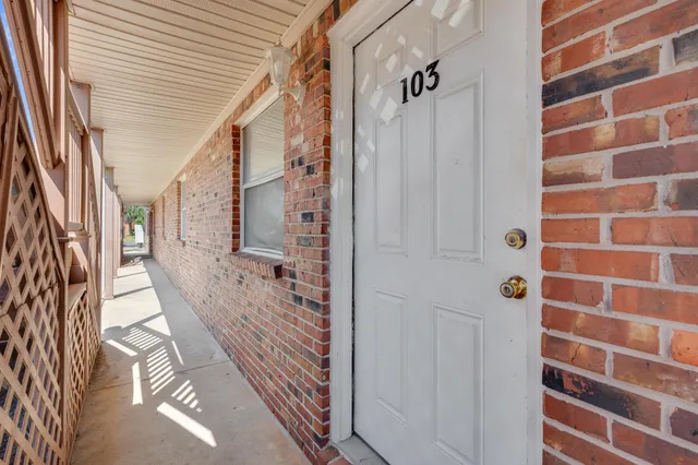 a bathroom with a shower and a sink