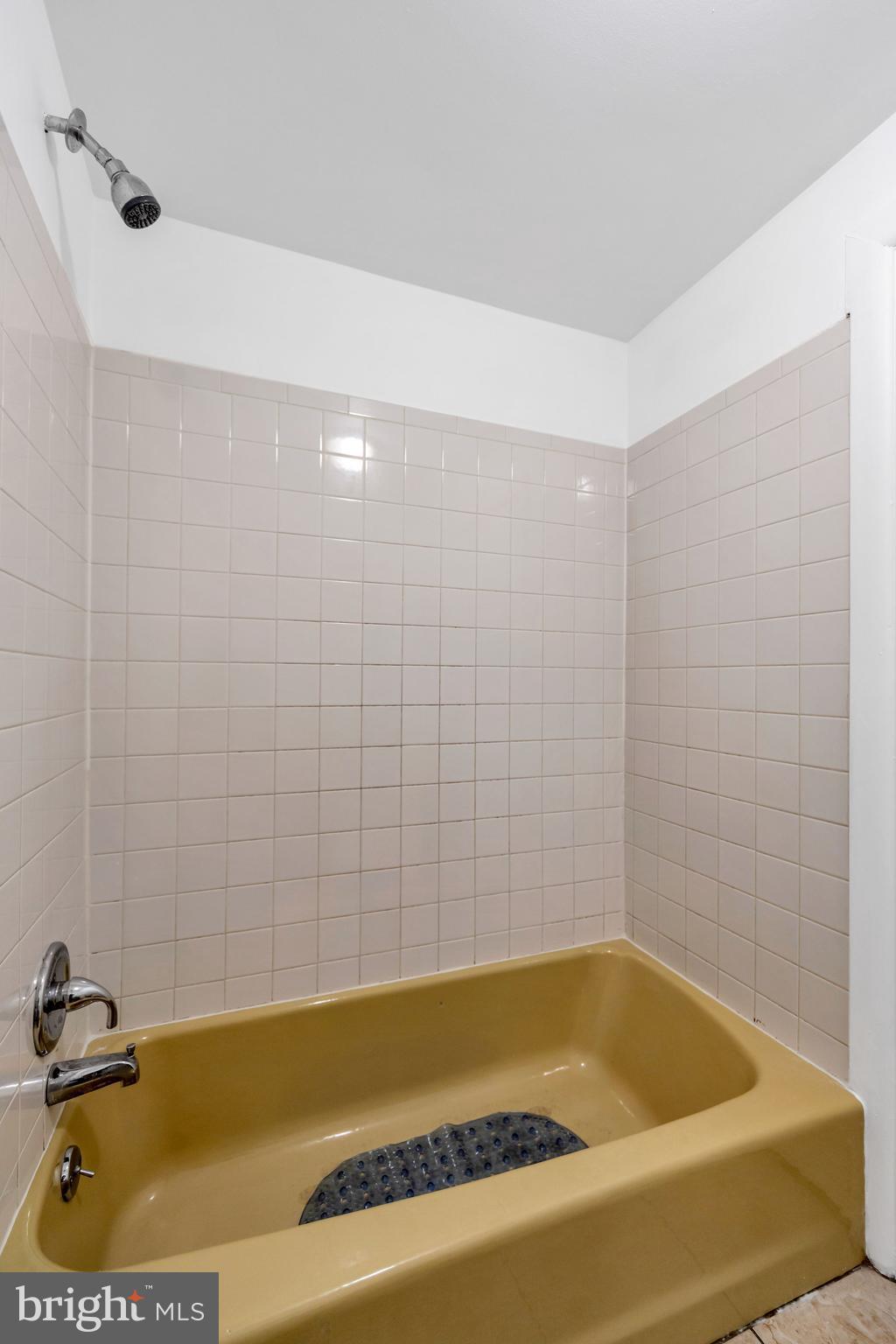 196 Springton Road Upper Darby, PA 19082 - Photo 19 of 27 a bathroom with a tub and a shower