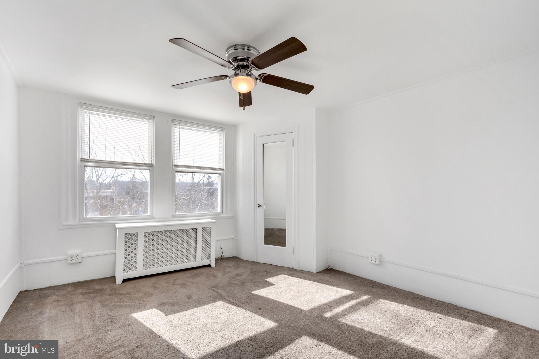 196 Springton Road Upper Darby, PA 19082 - Photo 21 of 27 a view of an empty room with a window