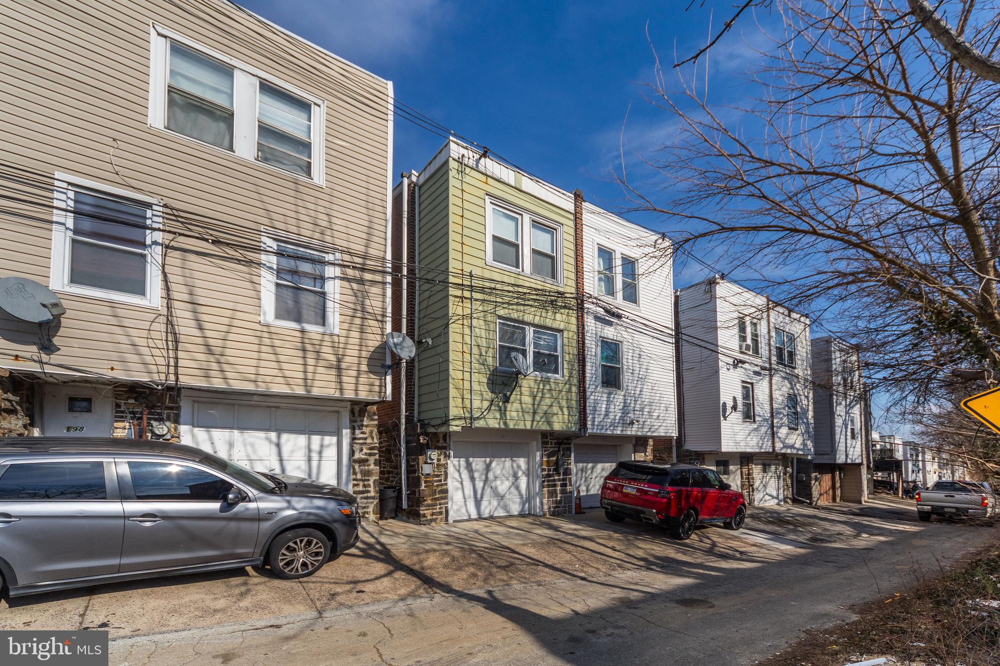 196 Springton Road Upper Darby, PA 19082 - Photo 25 of 27 a car parked in front of a house