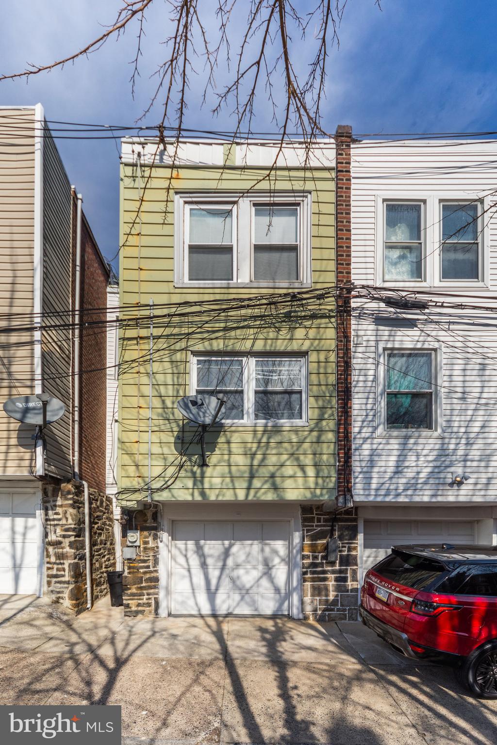 196 Springton Road Upper Darby, PA 19082 - Photo 27 of 27 a view of a brick house with a door of a house