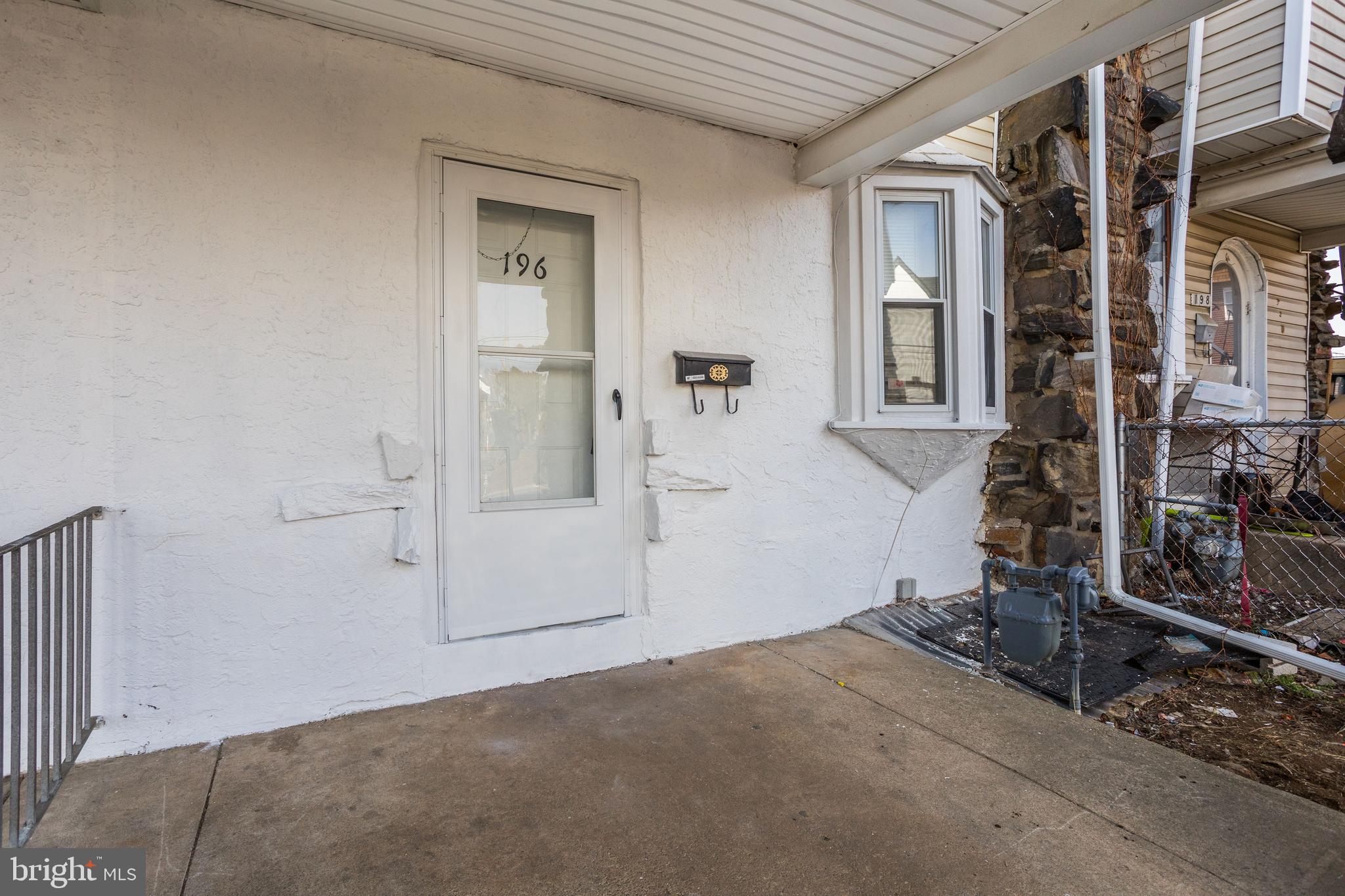 196 Springton Road Upper Darby, PA 19082 - Photo 4 of 27 a view of a livingroom with wooden floor and bathroom