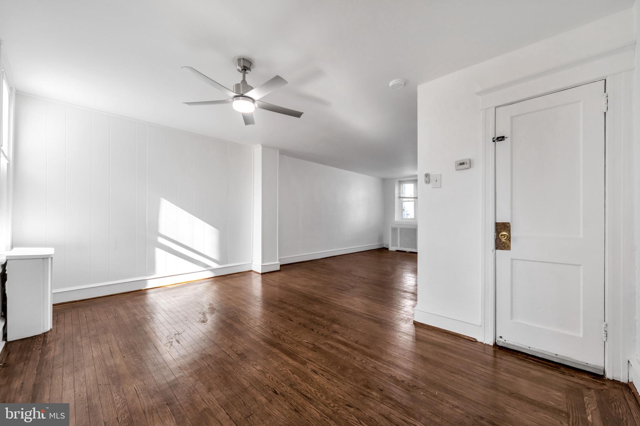 196 Springton Road Upper Darby, PA 19082 - Photo 10 of 27 a view of an empty room with wooden floor