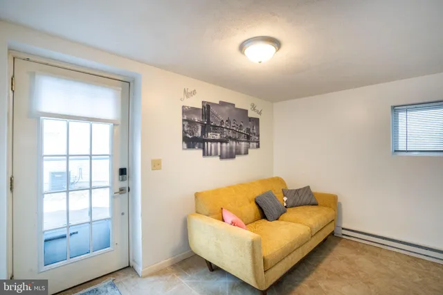 a bedroom with furniture and a wooden floor