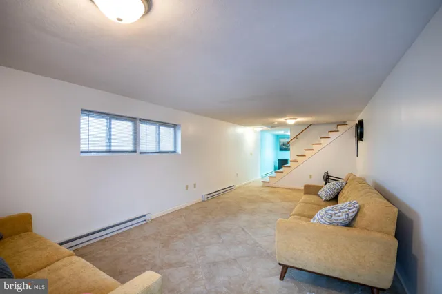 a view of a livingroom with washer and dryer